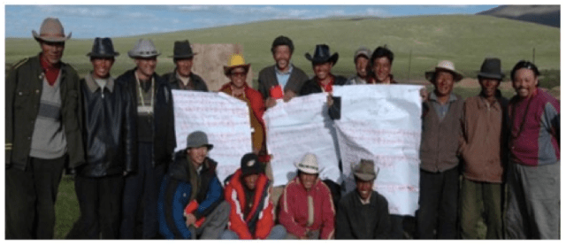 Community members display their conservation commitments and the benefits they receive through the Conservation Concession program [Photo/Shanshui Conservation Center]