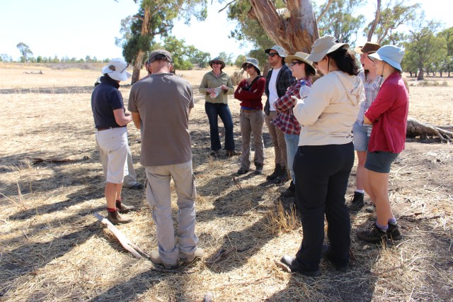 The group of interns listening carefully to the landowners and managers.
